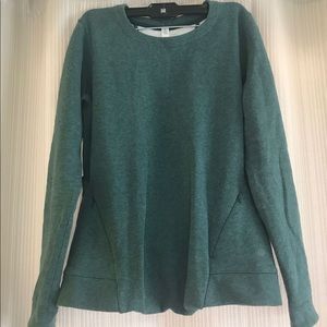 Lululemon heather green crewneck with racer-back cutout detail.